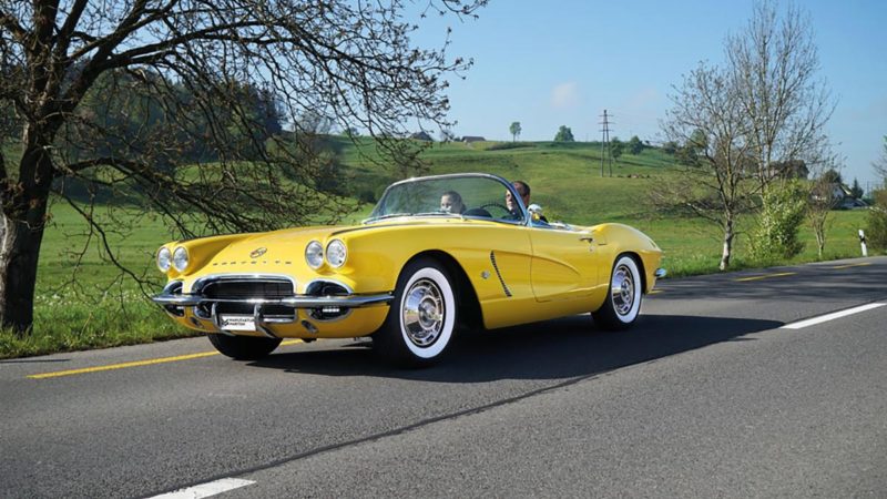 The yellow e-Corvette Dinora drives on a country road